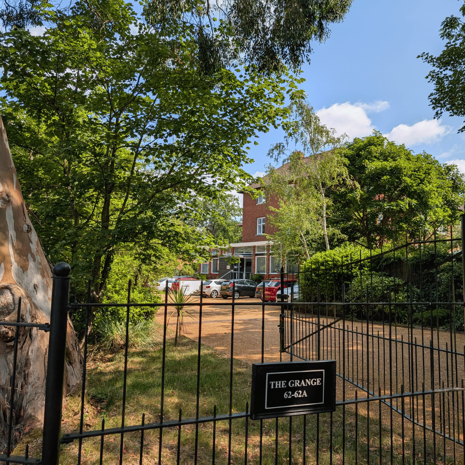 Picture of hte front of the Norwich office for Help for Psychology showing the front gates and driveway